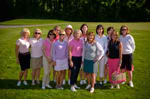 large group of golfers posing on course