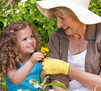 Gardening grandmother with child