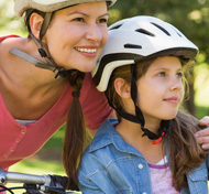 Mother and daughter cycling safely: http://health.sunnybrook.ca/prevent-injury/summer-safety-injury-prevention/