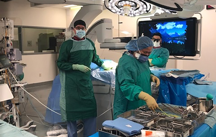Three doctors in a operating room