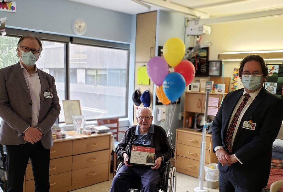 Hugh McGeach celebrating his 100th birthday with Sunnybrook’s President and CEO Dr. Andy Smith (l) and Executive Vice President and Chief Medical Executive Dan Cass (r).