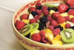 An image of a healthy fruit slaad, with strawberries, blackberries, raspberries, pineappe, and kiwi.