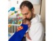 Baby in Superman costume with dad