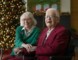 Suzie and John Stohn are shown smiling and holding each other at the Sunnybrook Veterans Centre, with Christmas decorations in the background