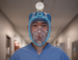 Dr. Brian Li wears a full-faced snorkel mask being designed as a N95 alternative