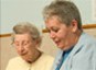 Caregiver helps Alzheimer's patient