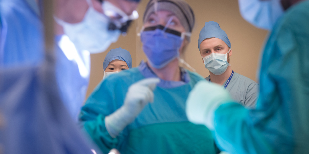 A group of doctors inside of a operating room