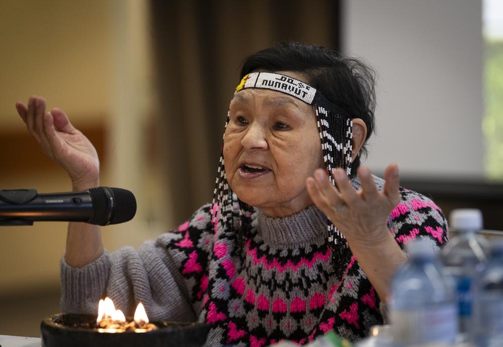 Inuk Elder Naulaq Ledrew sharing the teachings of the Inukshuk and lighting the qulliq.