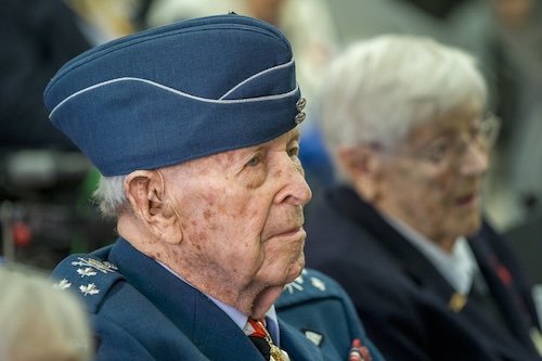 A world war two veteran sits at a remembrance day ceremony 