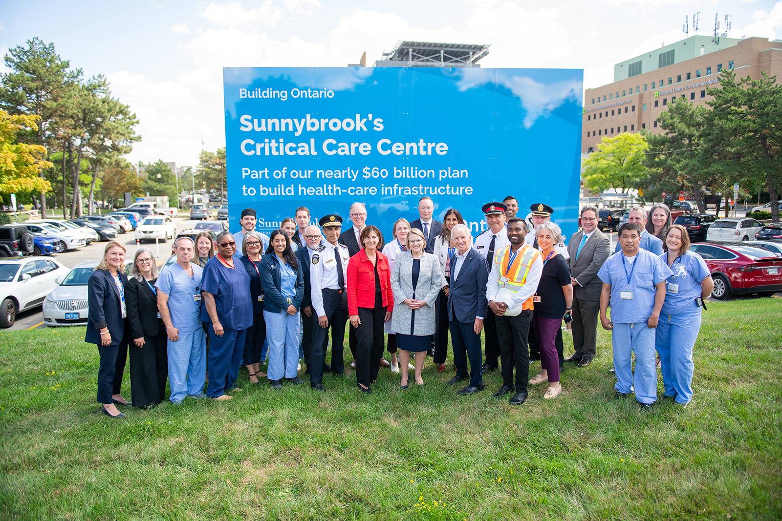 Sunnybrook staff pose for a group photo outside of Sunnybrook hospital