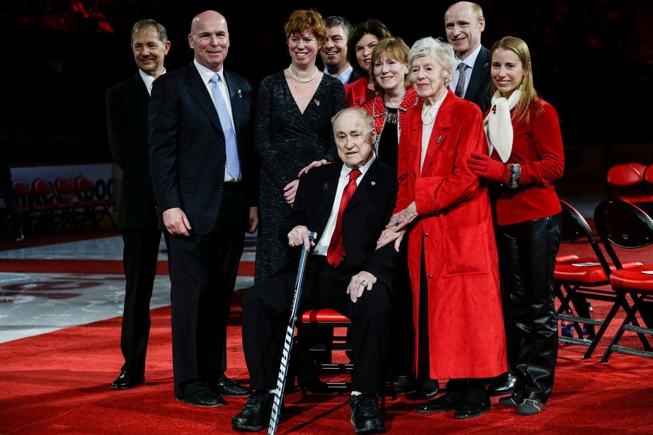 Former Sunnybrook patient and NHL Hall of Famer, Red Kelly holding a Wockey Stick at his jersey retirement ceremony in Detroit, Michigan.