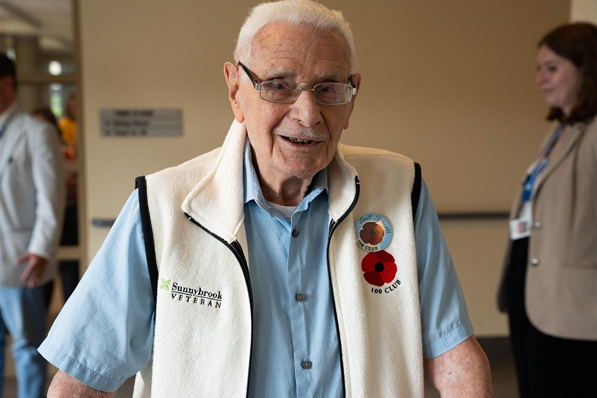A veteran wearing a Sunnybrook branded white vest