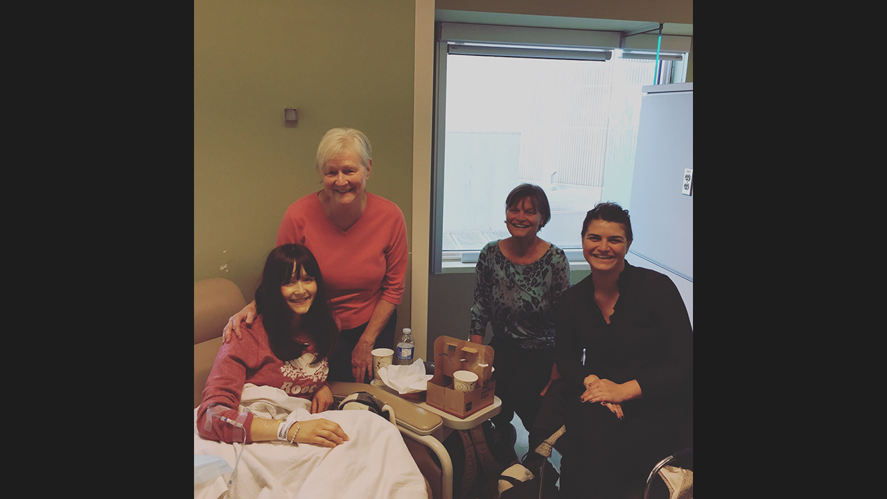 Kat and her mother and family members in hospital