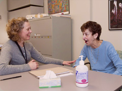 A speech pathologist enjoys a fun and productive session with one of our patients
