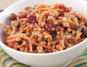 A wheat berry salad with wheatberry, carrot shavings, raisins and dried cranberries.