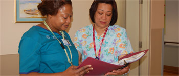 Staff reviewing care plan